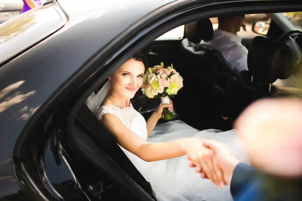 Bride Exiting Car Smiling Philadelphia County Pennsylvania in Philadelphia, Pennsylvania