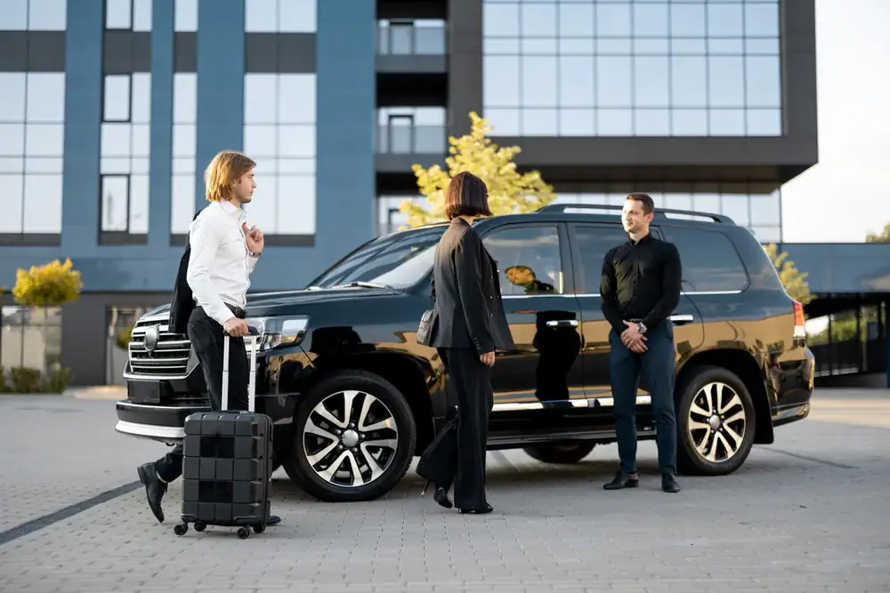 A professional business meeting in Philadelphia County, Pennsylvania, with a luxury limo awaiting business travelers for a smooth and reliable ride with Philadelphia Car and Limo