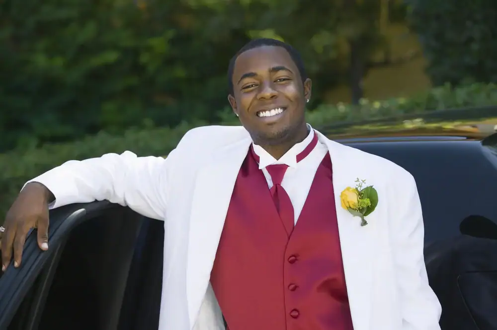 "Dressed in a sharp wedding suit, the groom smiles confidently as he steps out of a luxurious Philadelphia Car and Limo, setting the tone for a memorable wedding in Philadelphia County.