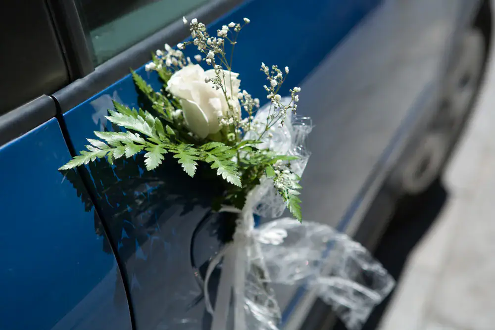 Elegant wedding car with beautifully arranged floral decorations in Philadelphia County, Pennsylvania, providing a luxurious and romantic touch for your special day