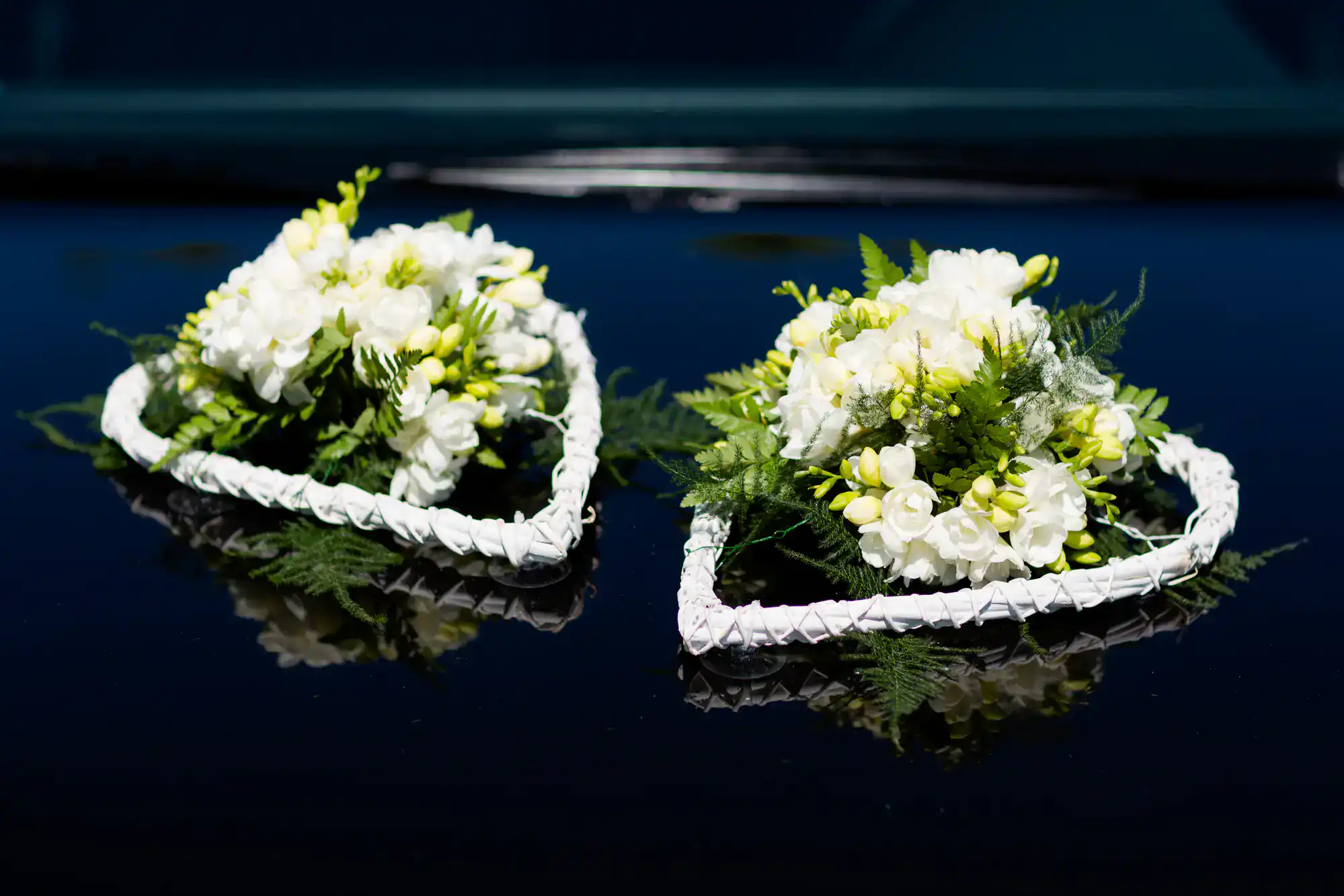 Elegant wedding limousine in Philadelphia adorned with beautiful floral arrangements, highlighting luxurious decorations perfect for couples celebrating their special day