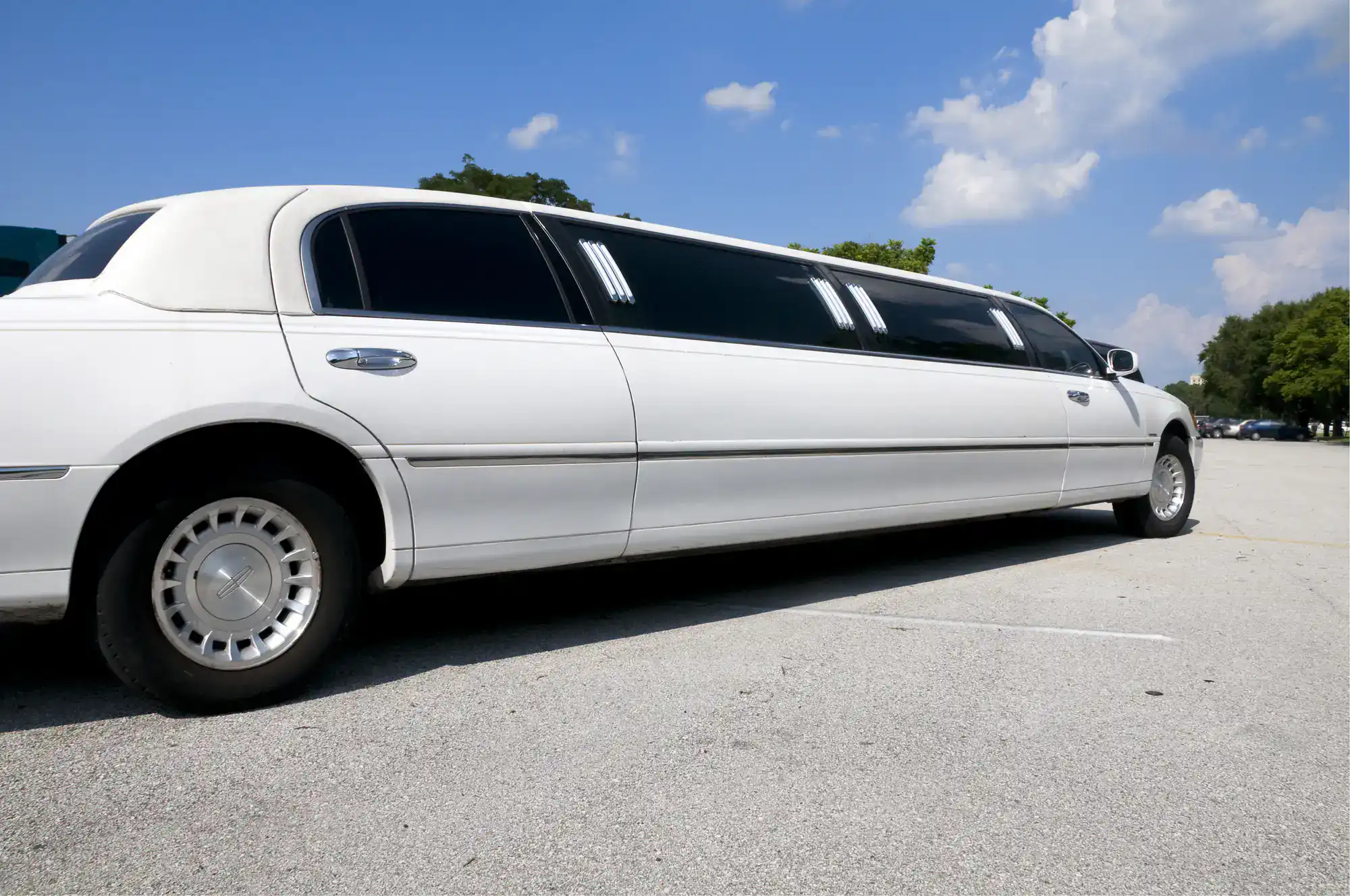 A sleek white wedding limousine parked in Philadelphia County, PA, ready to transport a bridal party in style, showcasing Philadelphia Car and Limo’s luxury wedding transportation services